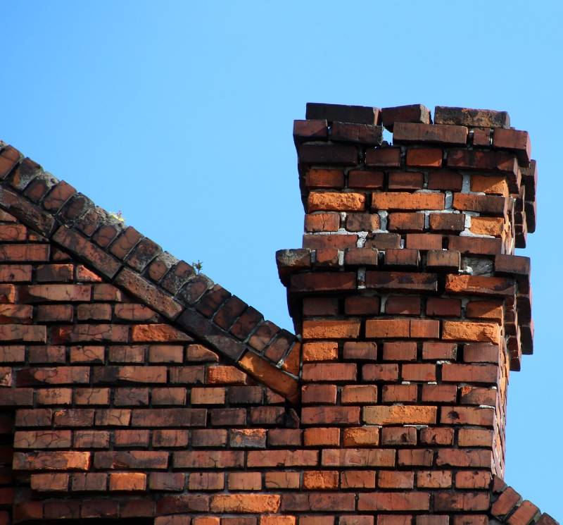 Damaged chimney on an La Habra home showing cracks and missing mortar